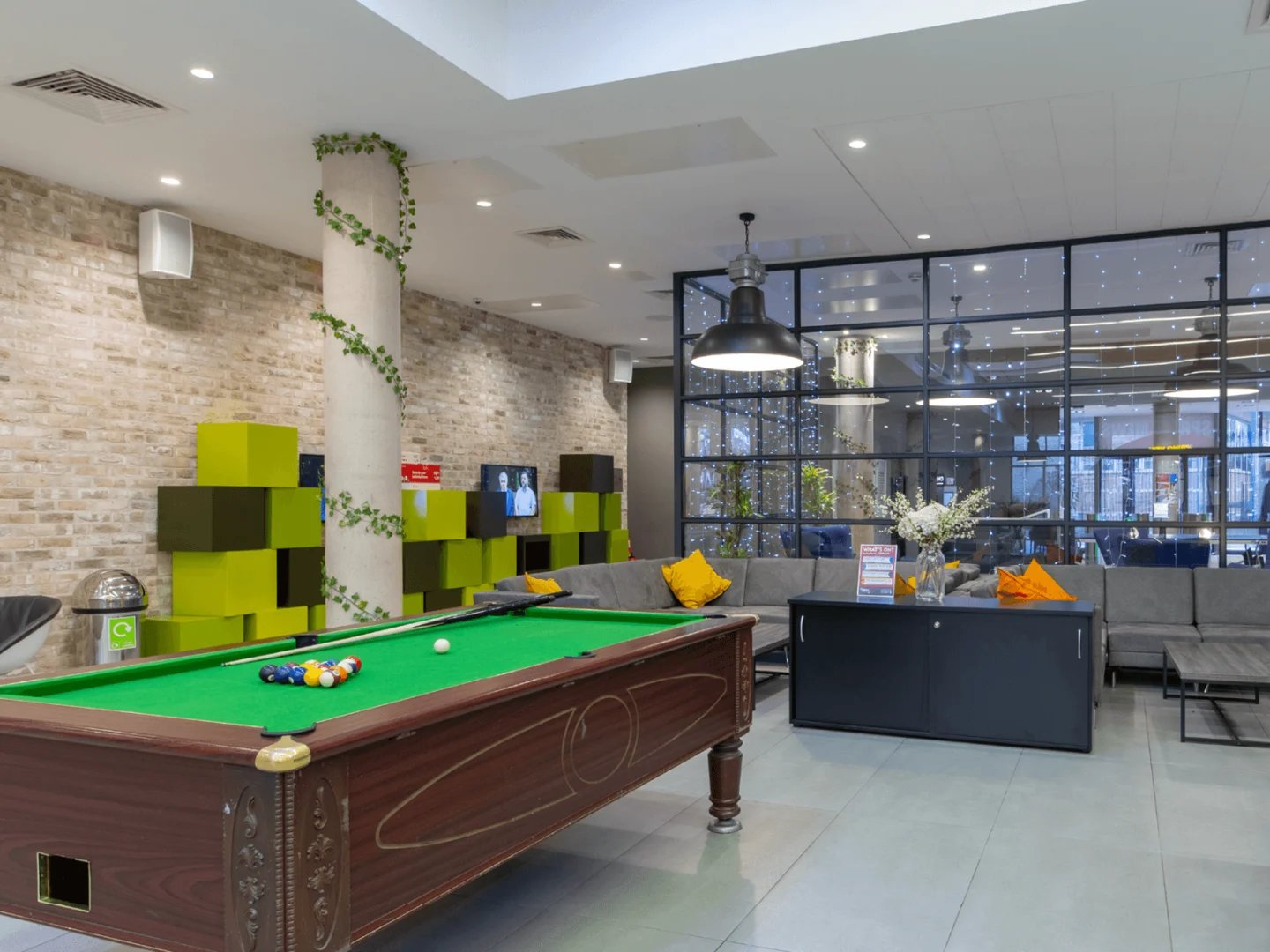 Pool table sofas and modern decor communal area at Spring Mews in London Student Accommodation