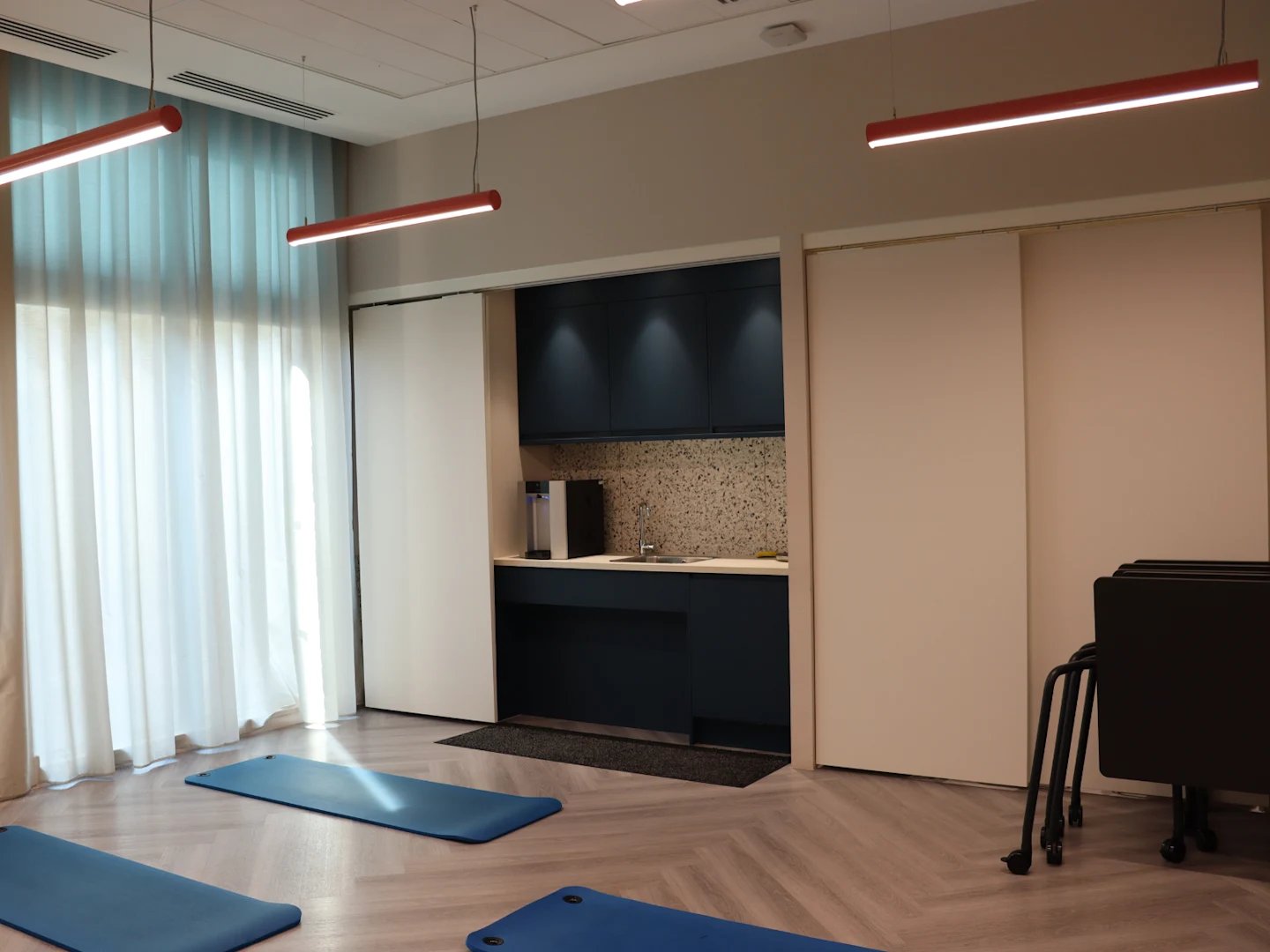 Yoga mats by kitchen area and window area at Spring Mews in London Student Accommodation