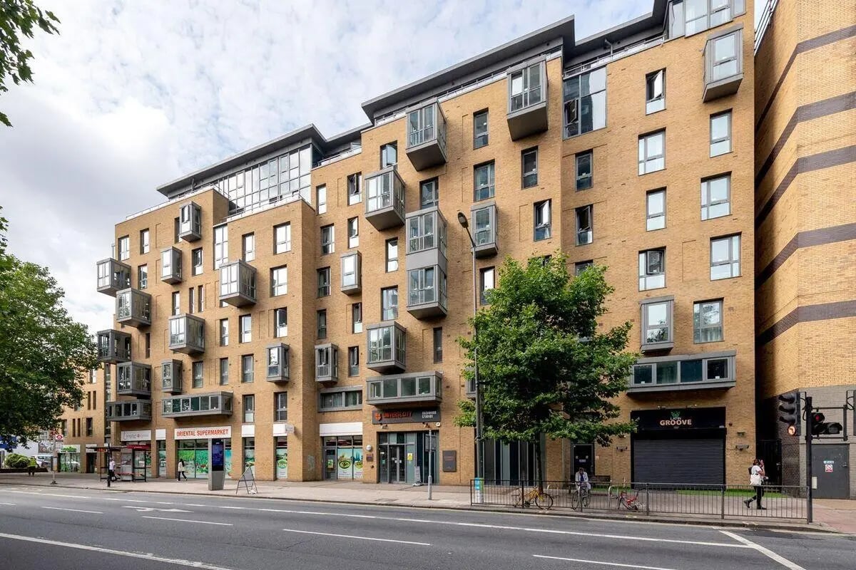 Modern brick building with many balconies exterior at Collegiate Dashwood Studios in London Student Accommodation