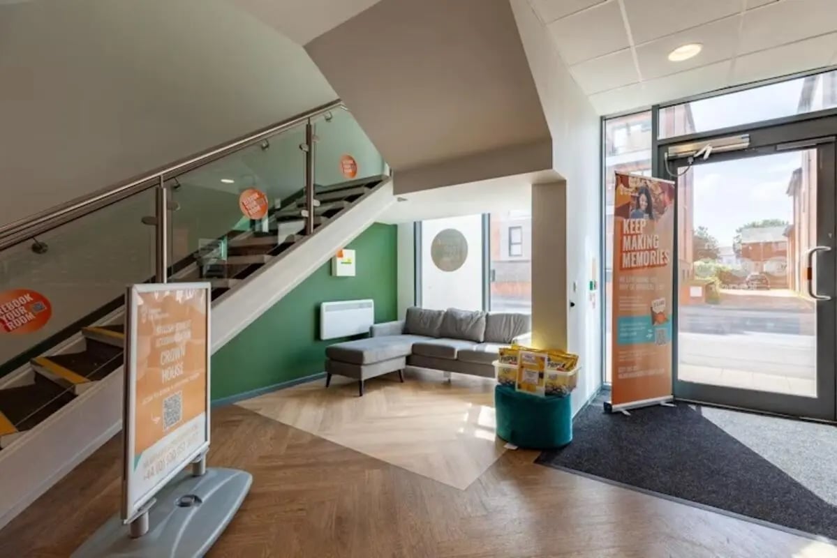 Stairs sofa and banners common area at Crown House - Reading in Reading Student Accommodation