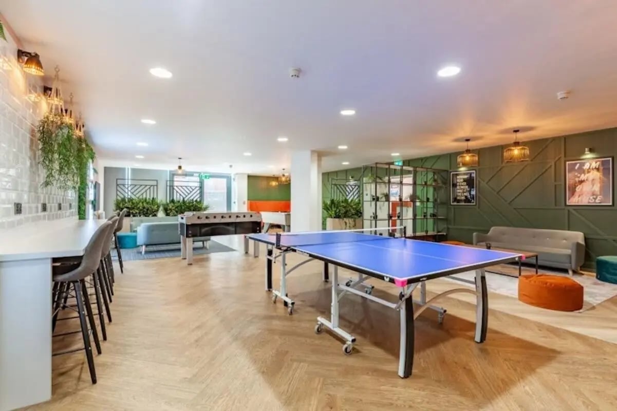 Ping pong table foosball table lounge area living room at Crown House - Reading in Reading Student Accommodation