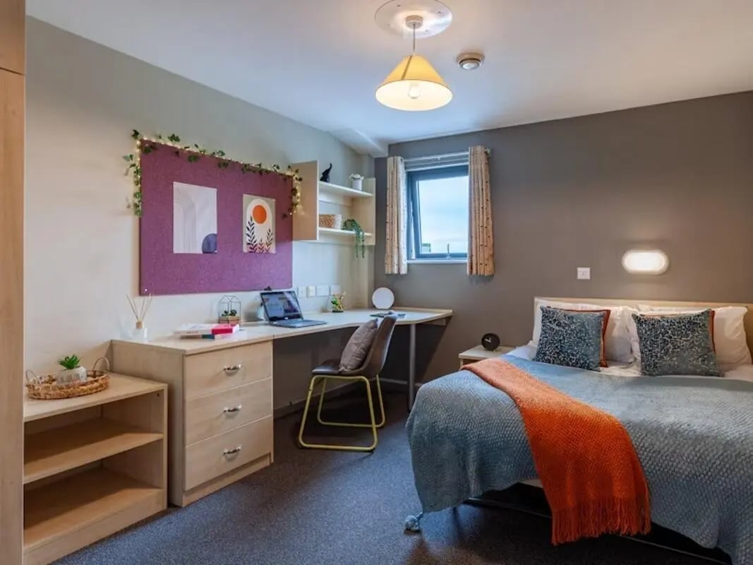 Bed desk corkboard and shelving bedroom at Crown House - Reading in Reading Student Accommodation
