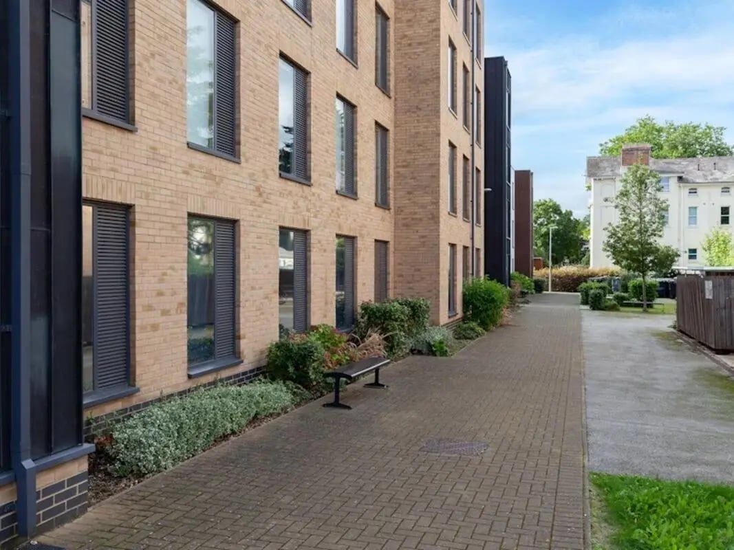 Brick building with bench and pathway exterior at Kendrick Hall in Reading Student Accommodation