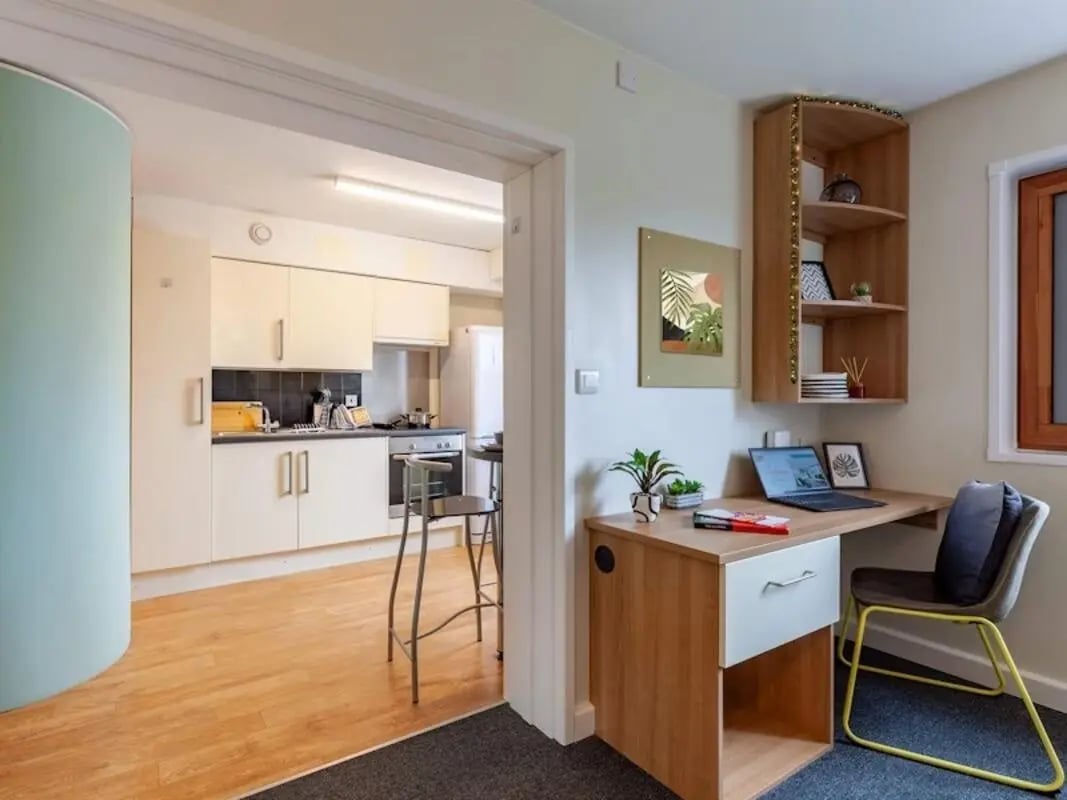 Kitchen and desk with laptop study area at Kendrick Hall in Reading Student Accommodation