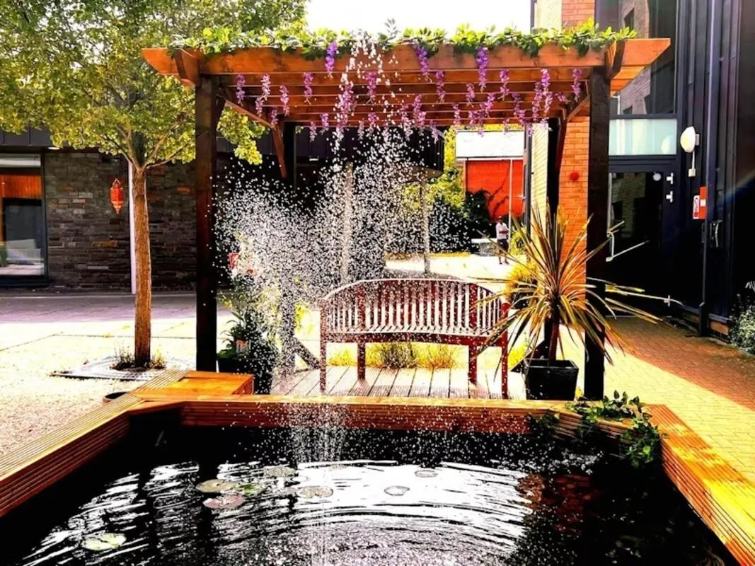 Pergola water feature wooden bench outdoor area at Kendrick Hall in Reading Student Accommodation