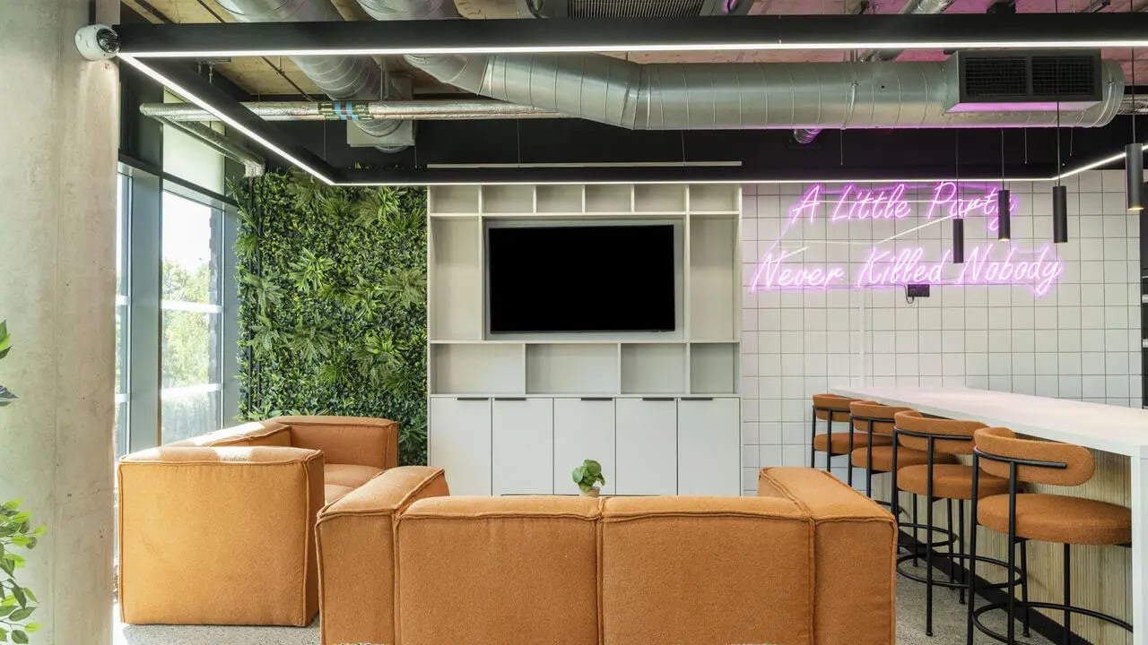 Sofa television wall bar stools living room at The Printworks in Exeter Student Accommodation