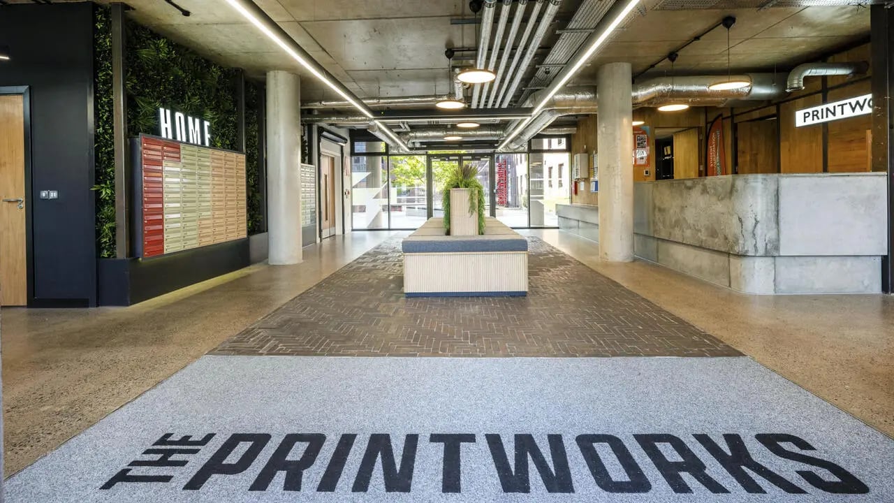 Mailboxes plants bench and reception desk lobby at The Printworks in Exeter Student Accommodation