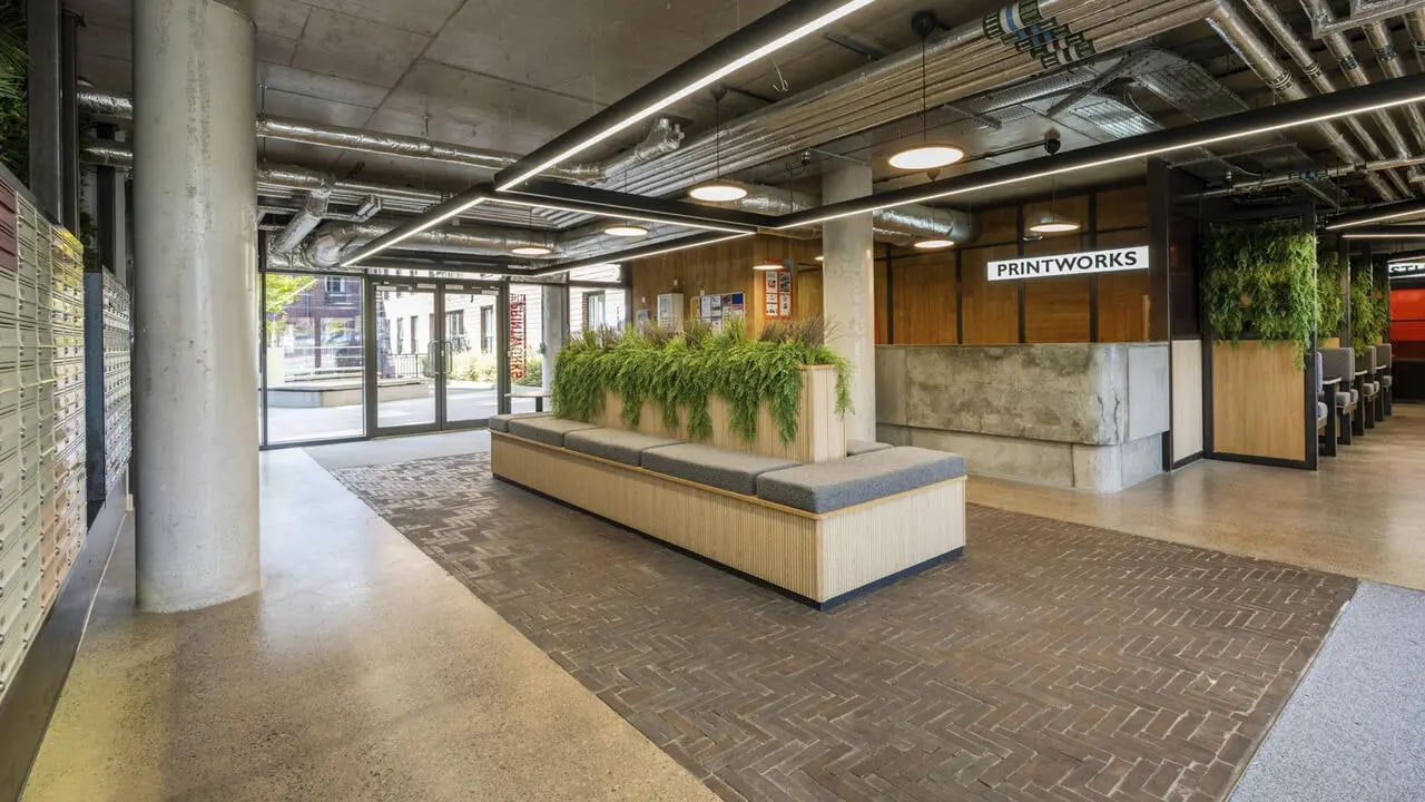 Lobby with seating and plants lounge area at The Printworks in Exeter Student Accommodation