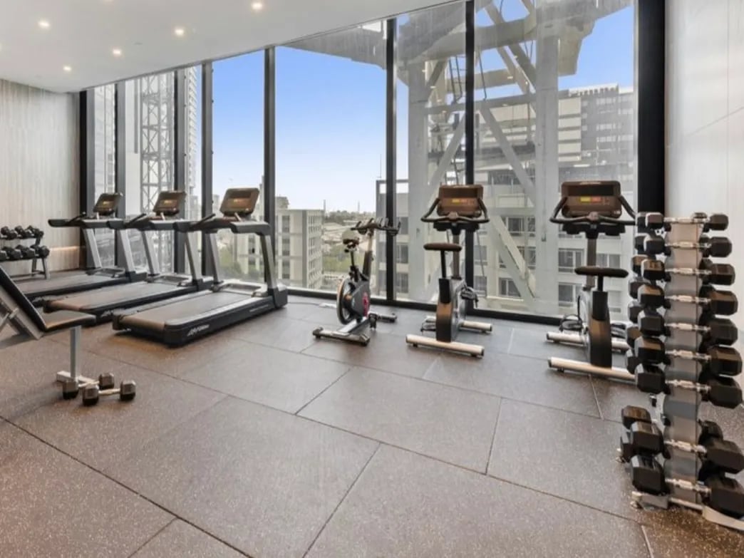 Treadmills exercise bikes dumbbells gym at Belong Melbourne CBD in Melbourne Student Accommodation