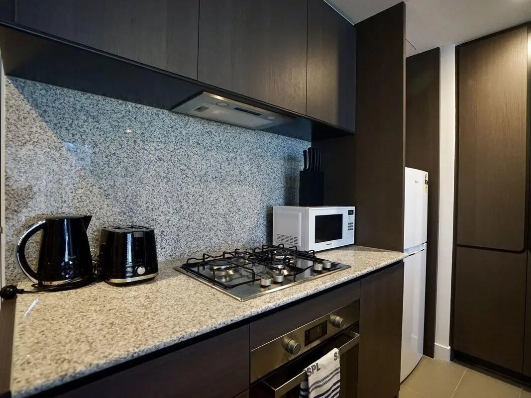Kettle toaster microwave stove fridge kitchen at Belong Melbourne CBD in Melbourne Student Accommodation