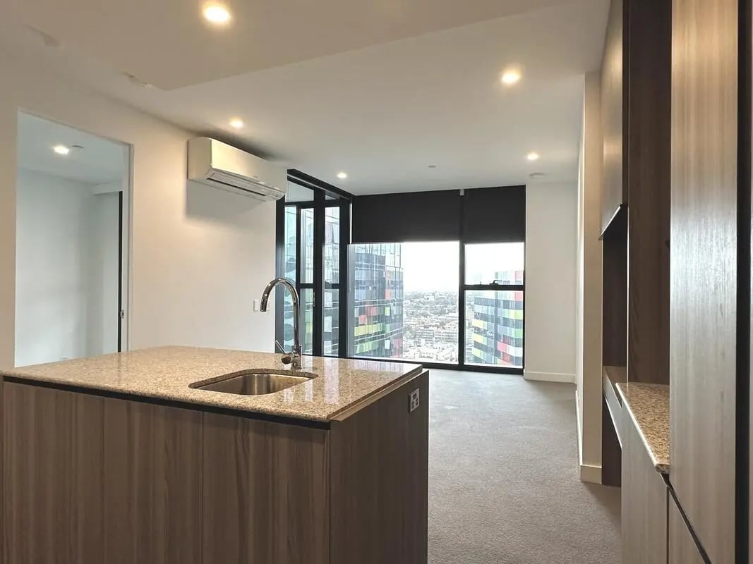 Kitchen island sink faucet and city view kitchen at Belong Melbourne CBD in Melbourne Student Accommodation