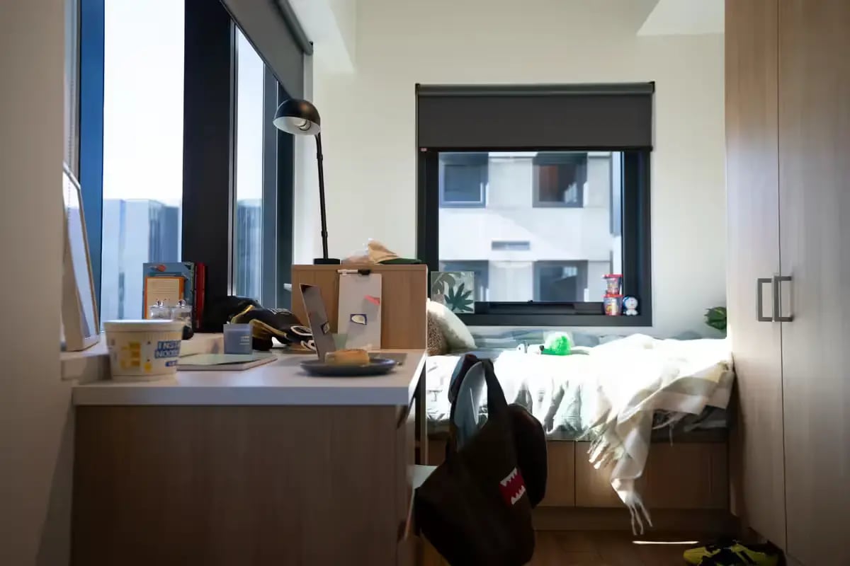 Desk lamp laptop bed closet bedroom at Scape Carlton in Melbourne Student Accommodation
