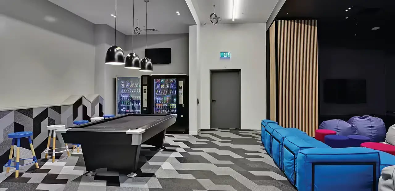 Pool table vending machines sofas beanbags communal area at Scape Melbourne Central in Melbourne Student Accommodation