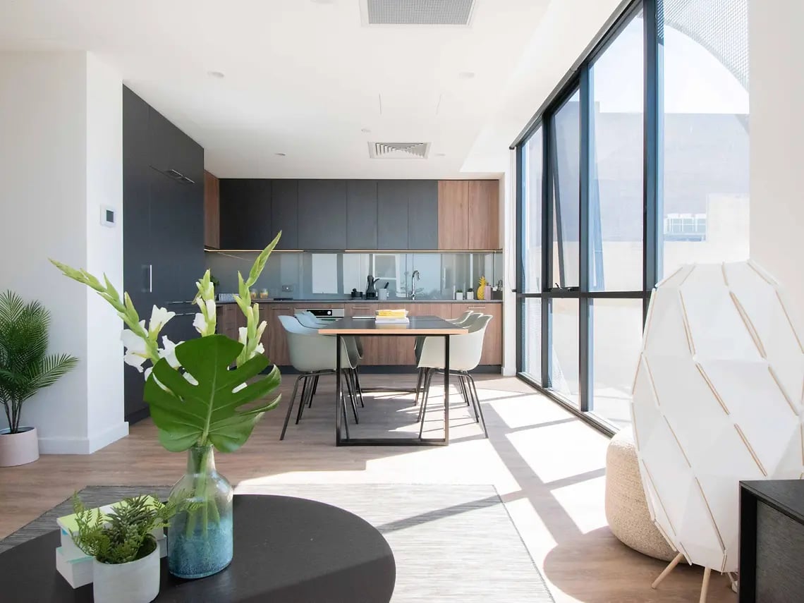 Modern kitchen dining area with large windows living room at Yugo Perth City in Perth Student Accommodation