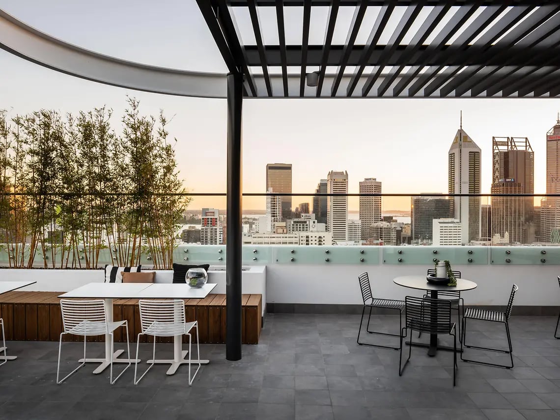 Outdoor dining area with city view exterior at Yugo Perth City in Perth Student Accommodation