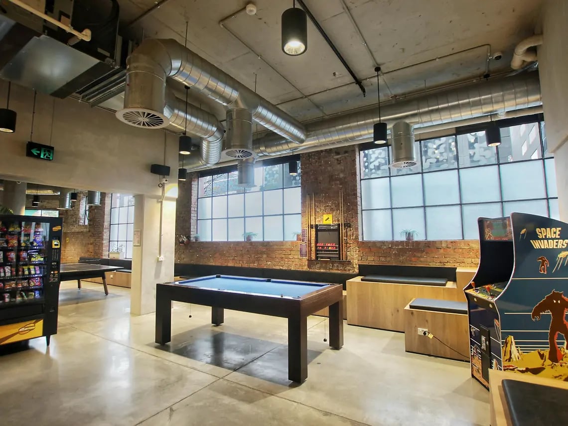 Pool table arcade vending machine recreation area at Yugo University Square Melbourne in Melbourne Student Accommodation