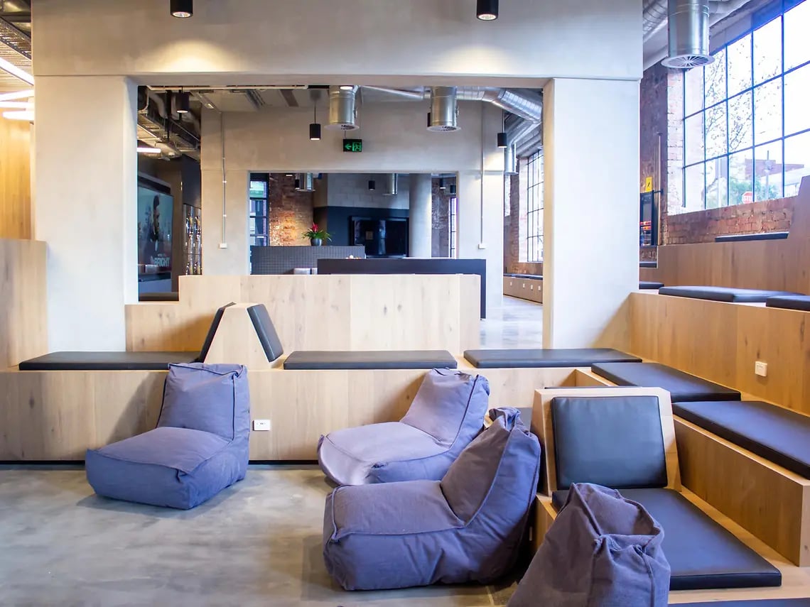 Beanbags tiered seating and lounge area living room at Yugo University Square Melbourne in Melbourne Student Accommodation