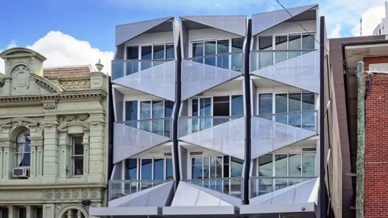 Modern building with balconies and large windows exterior at Student Living - Vivida in Melbourne Student Accommodation