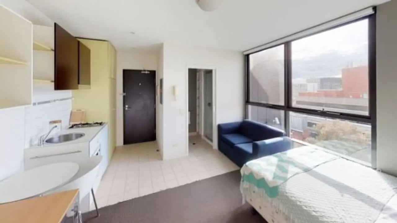 Kitchen sofa bed and window studio apartment at Student Living On Campus in Melbourne Student Accommodation