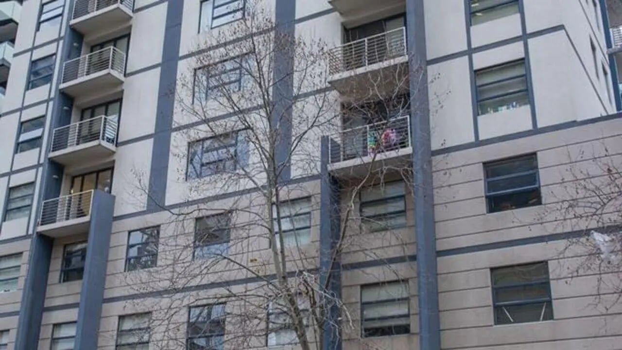 Apartment balconies with railings and windows exterior at Student Living On ABeckett in Melbourne Student Accommodation