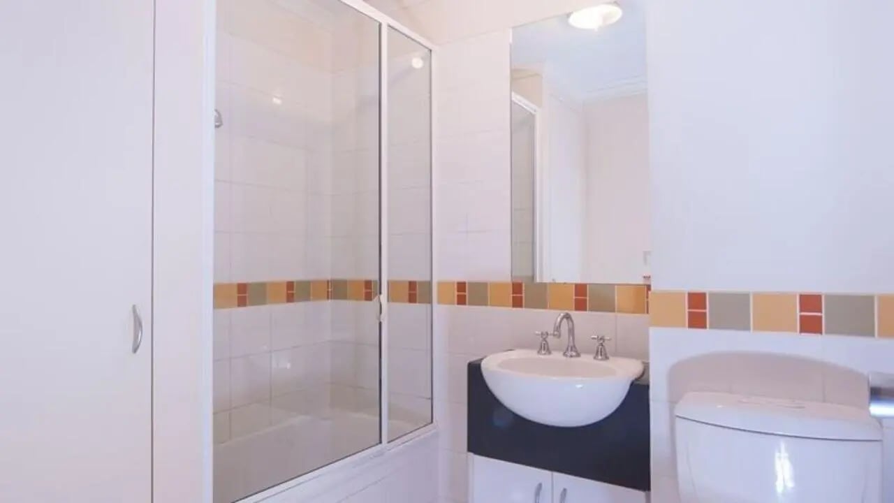Shower bath sink toilet and cupboard bathroom at Student Living on Flinders in Melbourne Student Accommodation