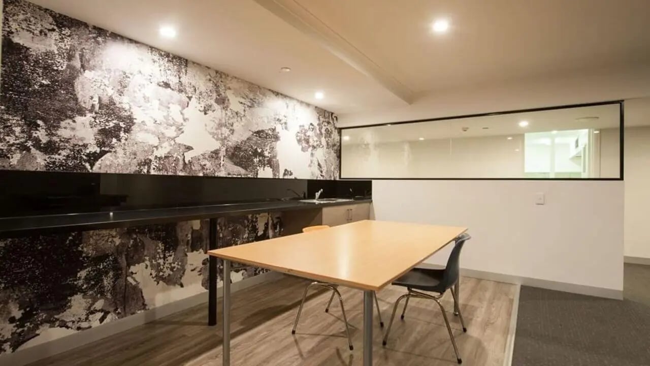 Table and chairs in communal kitchen area at Student Living on Flinders in Melbourne Student Accommodation