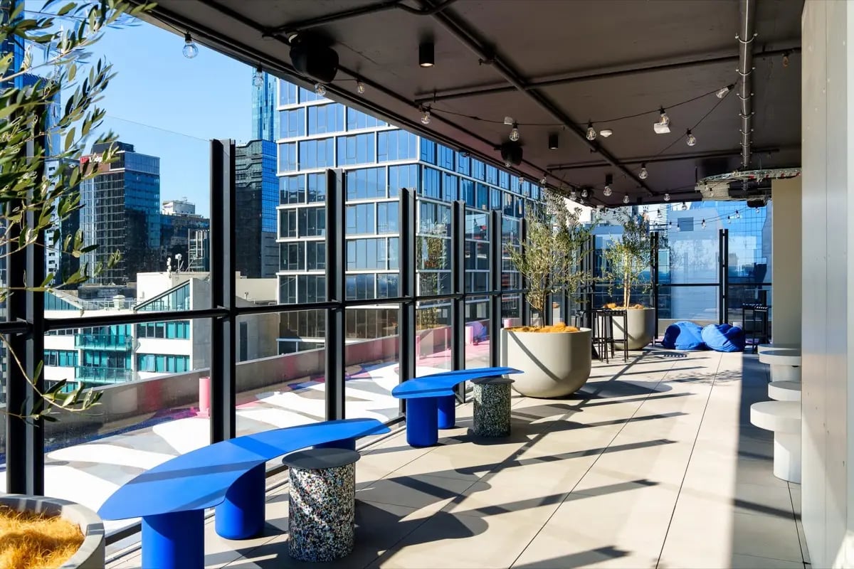Blue benches planters beanbags outdoor area at The Switch Melbourne Victoria Market in Melbourne Student Accommodation