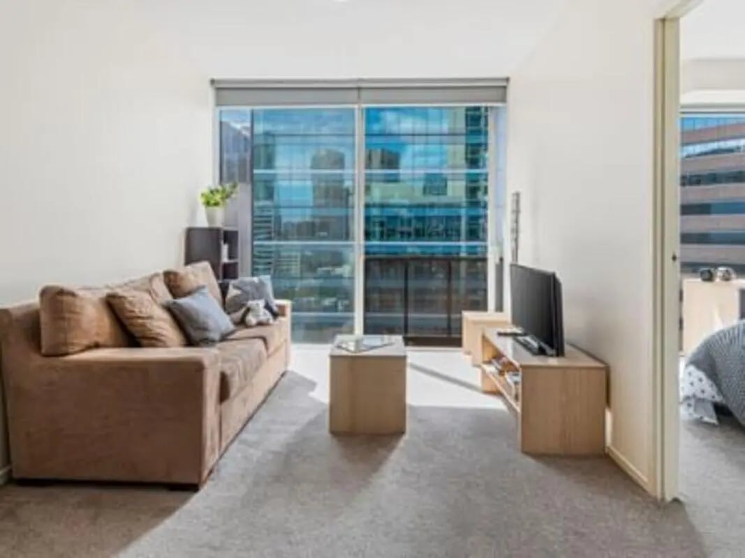 Sofa television coffee table living room at Student Living on Lonsdale in Melbourne Student Accommodation