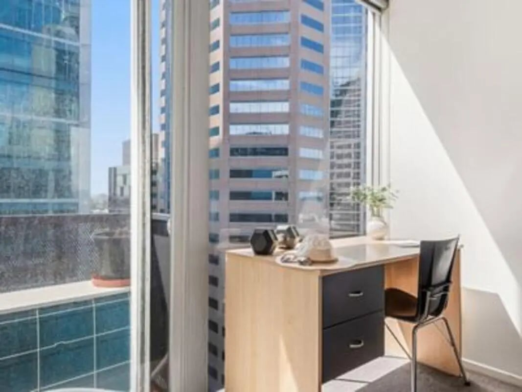 Desk with chair and city view study area at Student Living on Lonsdale in Melbourne Student Accommodation