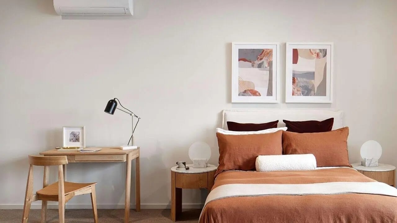 Desk chair lamp framed art and bed bedroom at Realm Caulfield in Melbourne Student Accommodation