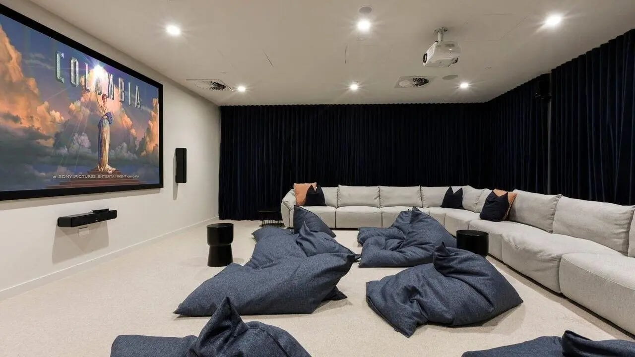 Cinema room with projector sofa and beanbags at Realm Caulfield in Melbourne Student Accommodation