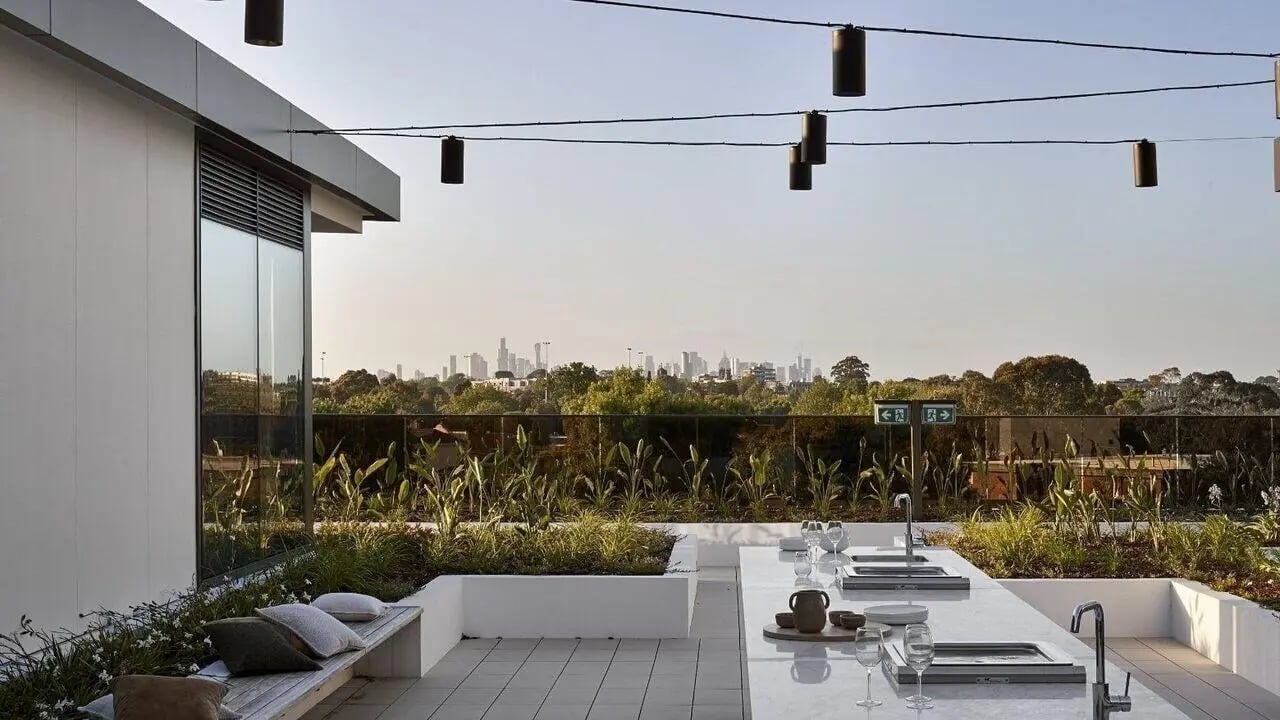 Bench with pillows kitchen counter skyline outdoor kitchen at Realm Caulfield in Melbourne Student Accommodation