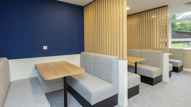 Booth seating and tables communal area at St Gabriels in Manchester Student Accommodation