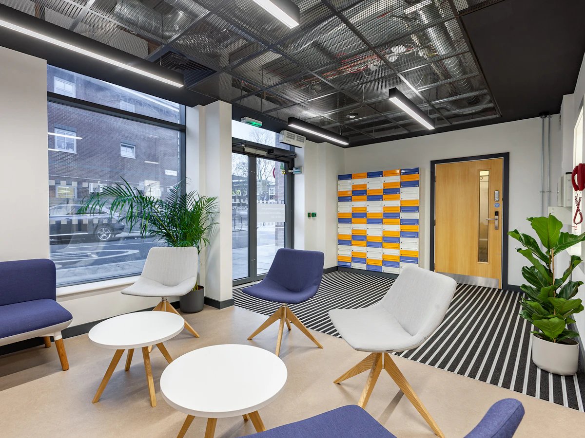 Colorful lockers wood door seating living area at Fulham Palace Studios in London Student Accommodation