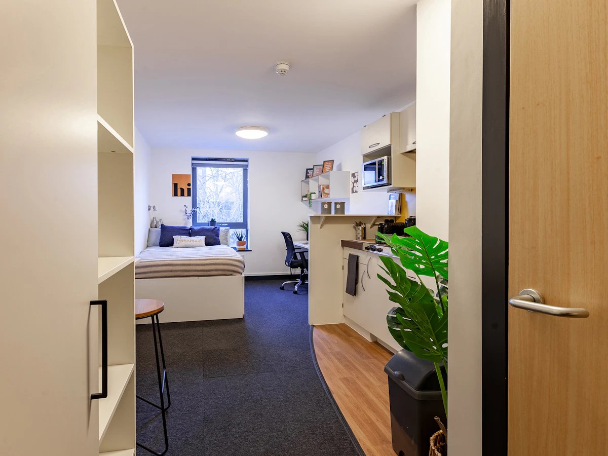 Bed kitchen and desk studio apartment at Fulham Palace Studios in London Student Accommodation