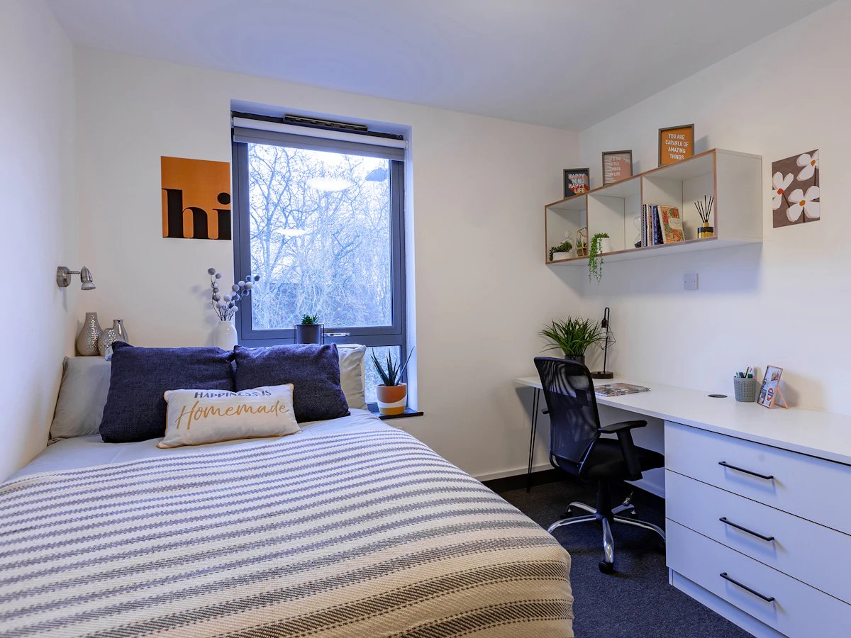 Bed desk shelf and window bedroom at Fulham Palace Studios in London Student Accommodation
