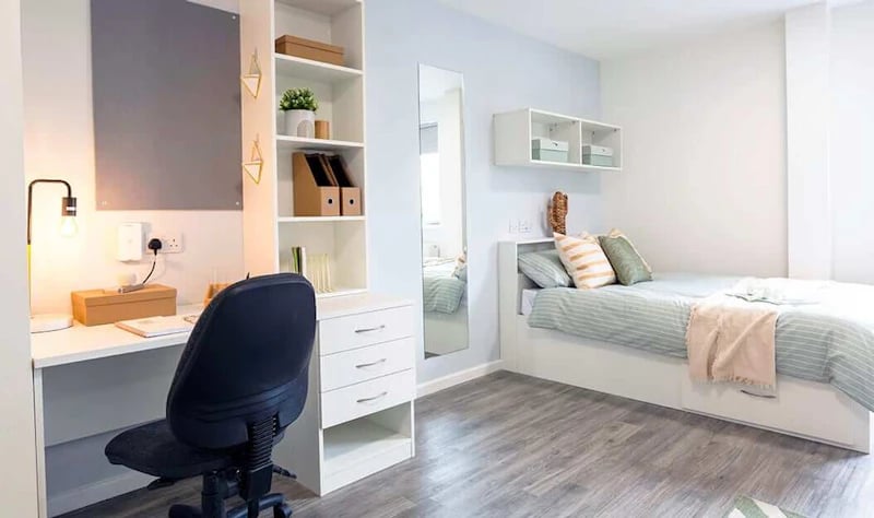 Desk bed shelves and mirror bedroom at Westcombe House in London Student Accommodation