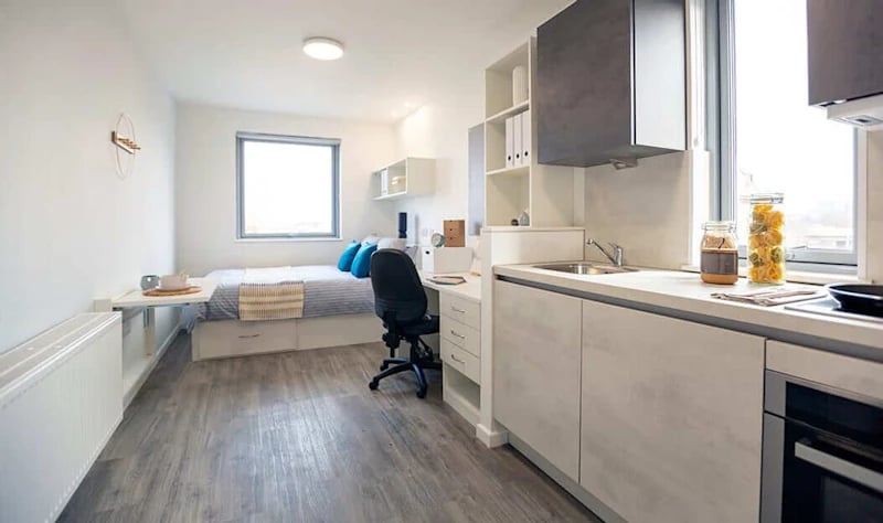 Bed desk chair kitchen and sink studio apartment at Westcombe House in London Student Accommodation
