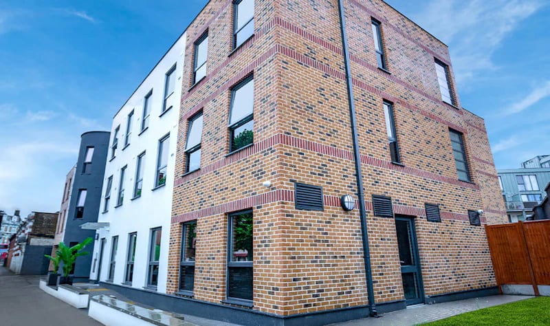 Modern brick building with many windows exterior at Westcombe House in London Student Accommodation