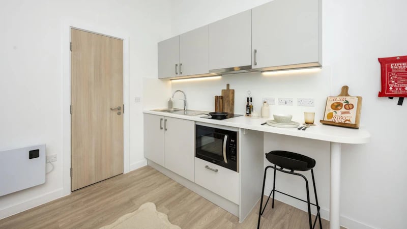 Modern studio kitchen with breakfast bar and stool kitchen at Westcombe House in London Student Accommodation