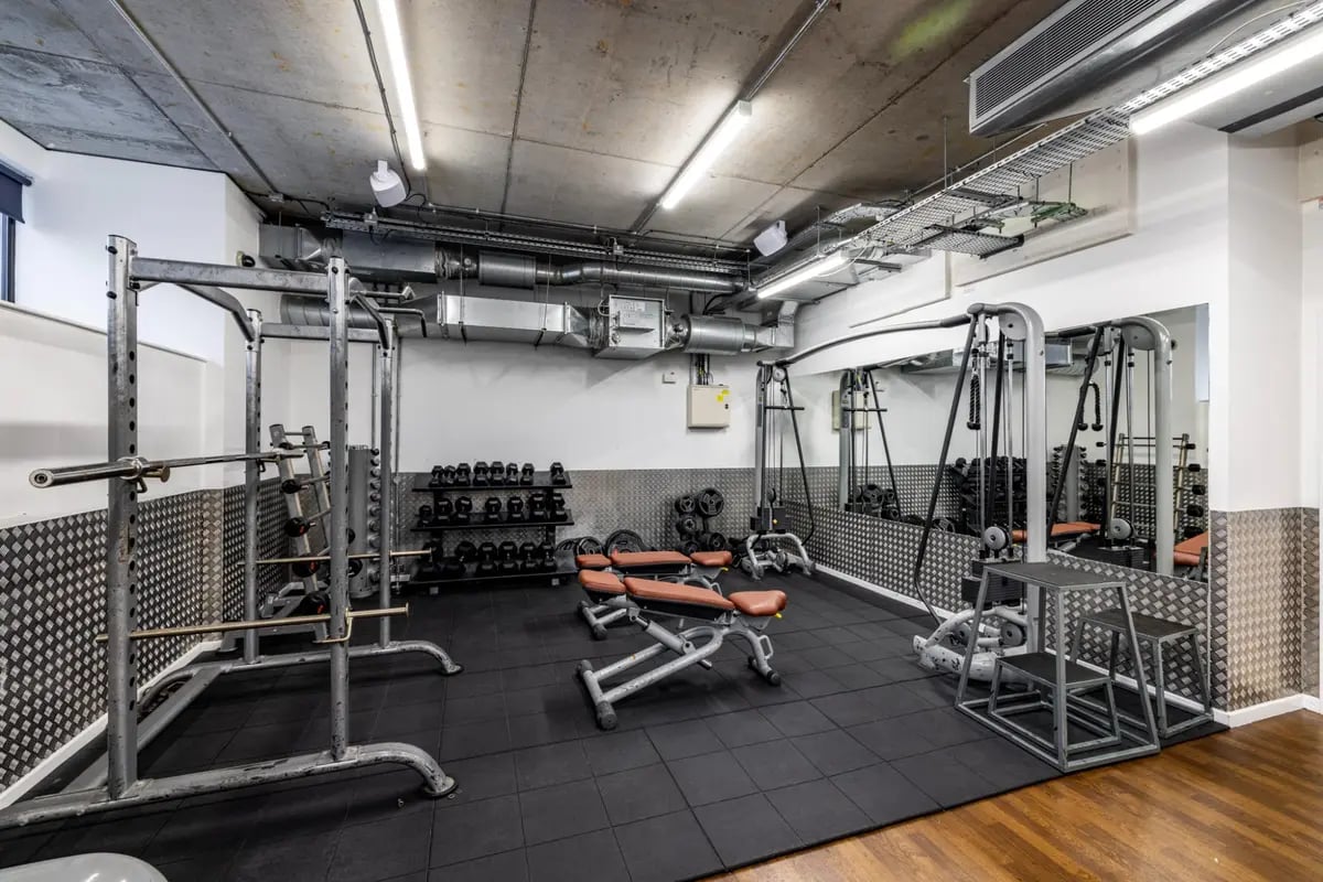 Gym equipment weights benches and mirrors gym at Chapter Portobello in London Student Accommodation