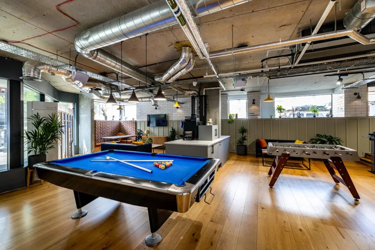Pool table foosball table seating lounge area at Chapter Portobello in London Student Accommodation