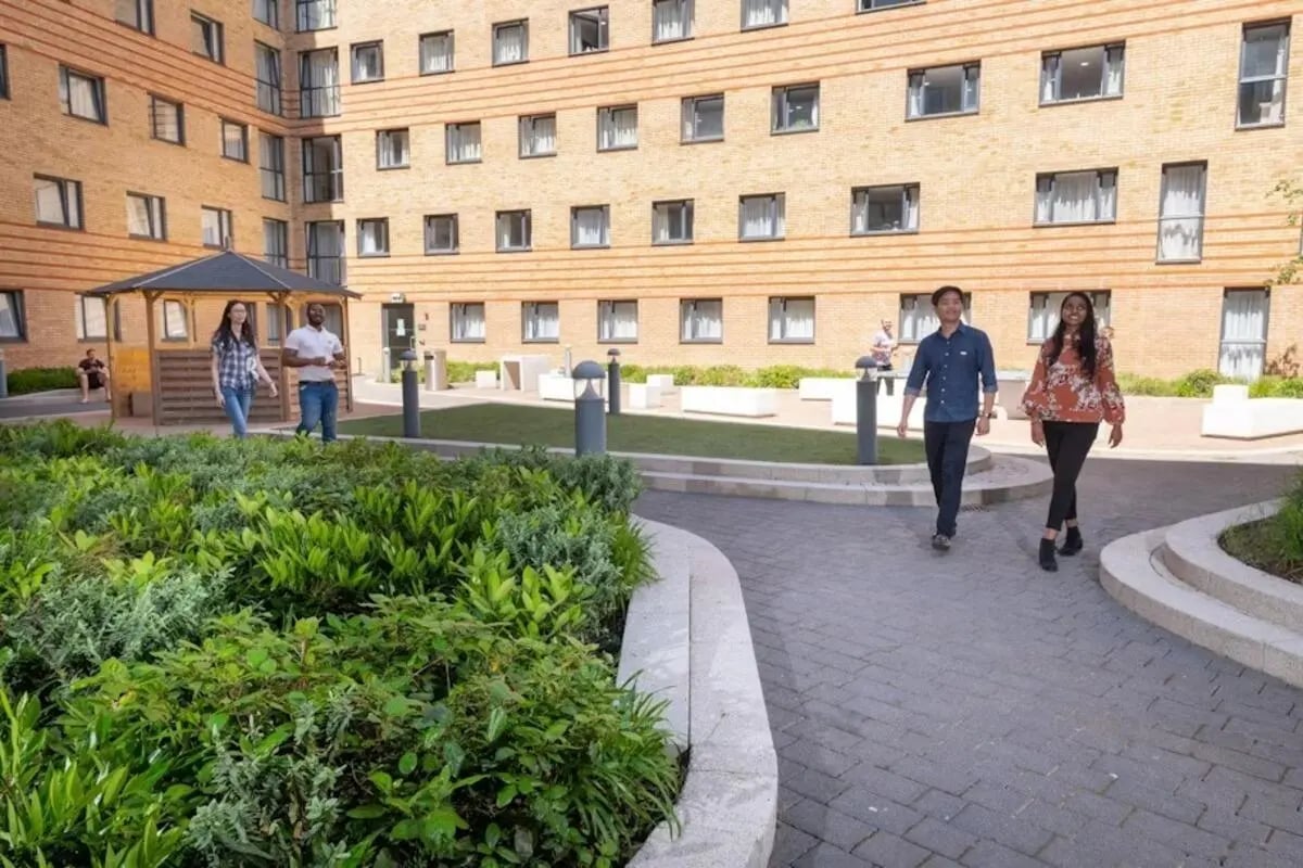 Courtyard with students walking students exterior at Mannequin House in London Student Accommodation