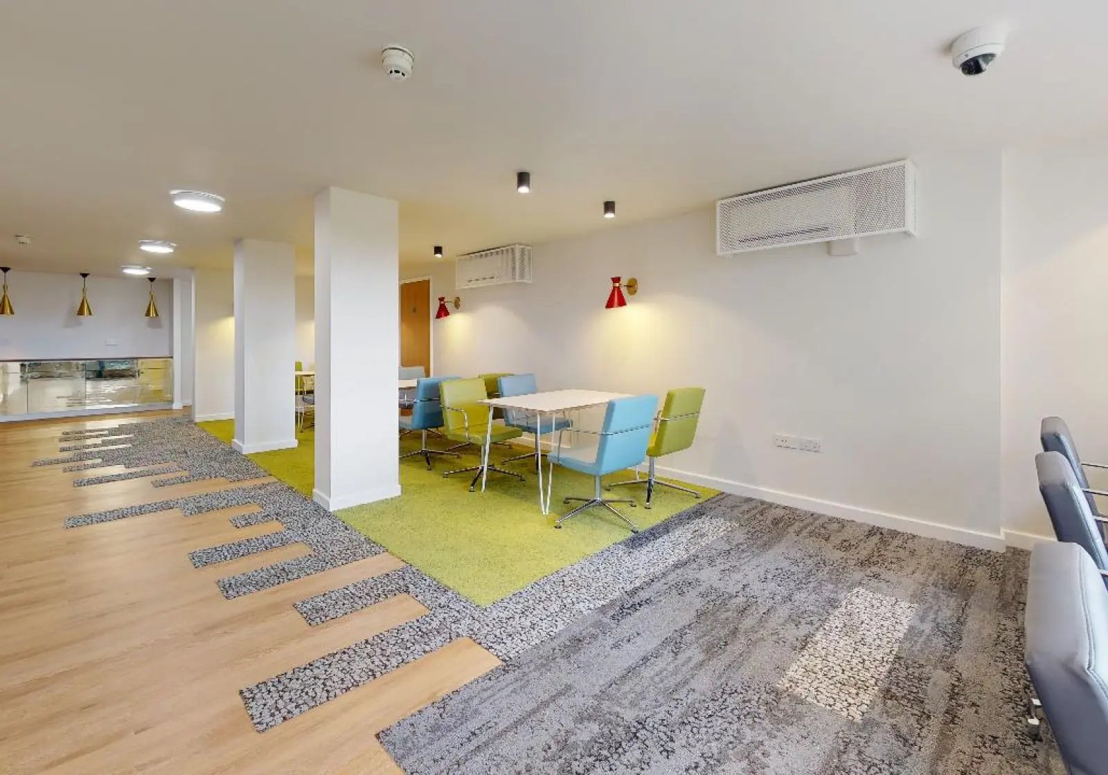 Tables and chairs in communal area at iQ Tufnell House in London Student Accommodation