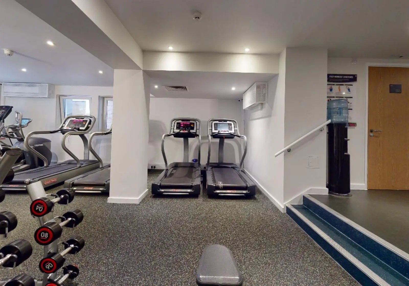 Treadmills dumbbells water cooler gym area at iQ Tufnell House in London Student Accommodation