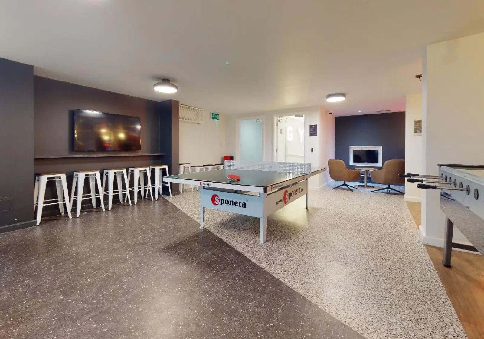 Ping pong table chairs TV lounge area at iQ Tufnell House in London Student Accommodation