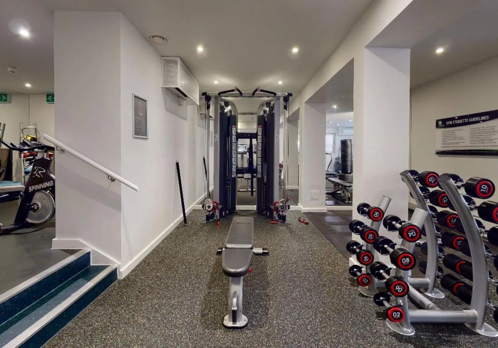 Spinning bike cable machine dumbbells bench gym at iQ Tufnell House in London Student Accommodation