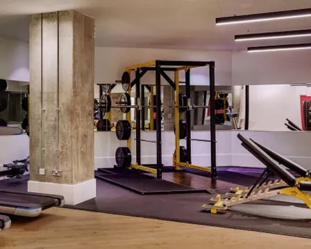 Weights rack treadmill and bench gym area at Scape Wembley in London Student Accommodation