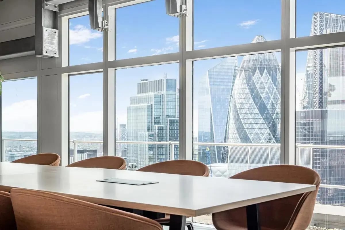 Conference table with chairs city view common area at Chapter Spitalfields in London Student Accommodation