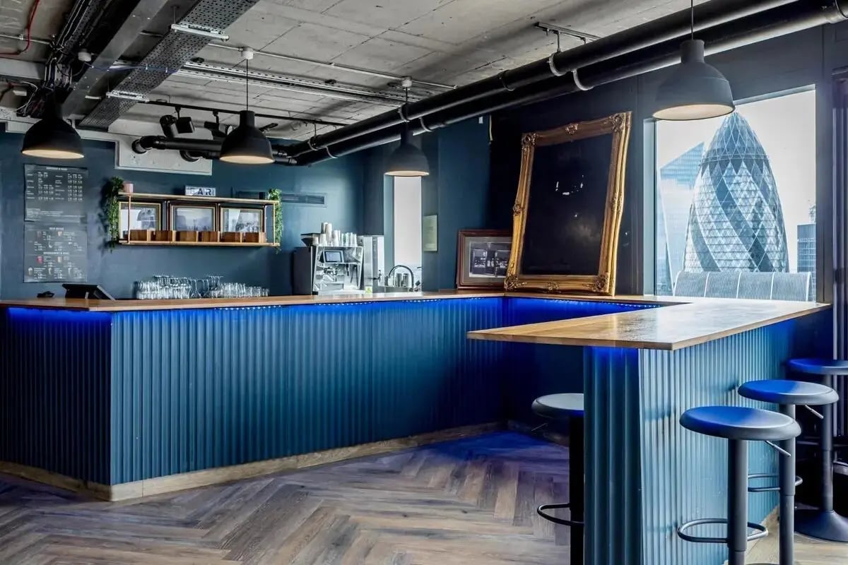 Bar with stools and city view common area at Chapter Spitalfields in London Student Accommodation
